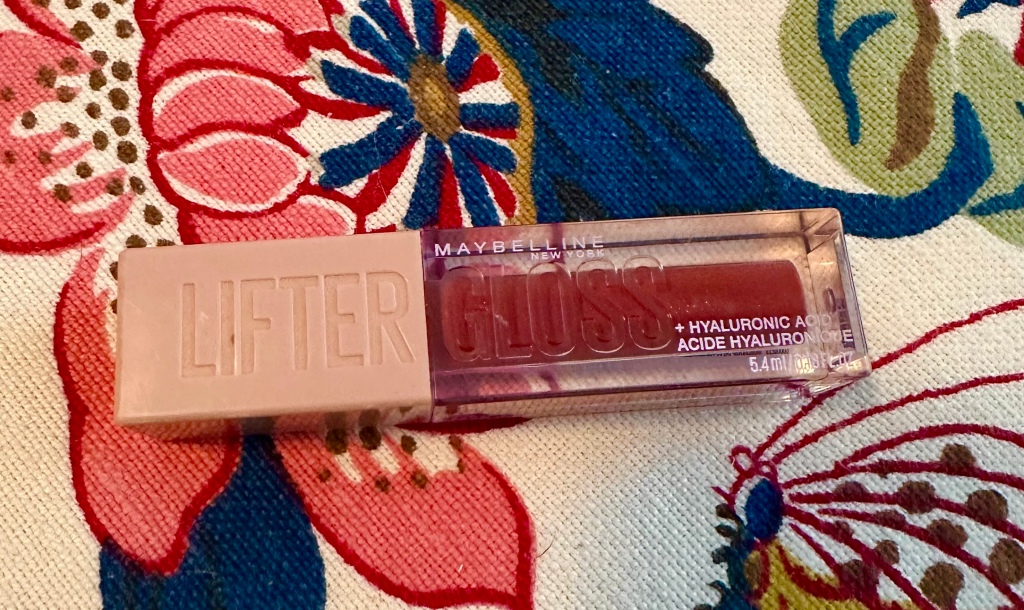 Maybelline Lifter Gloss in Rust, a rusty-coral shade with gold pearl finish. 